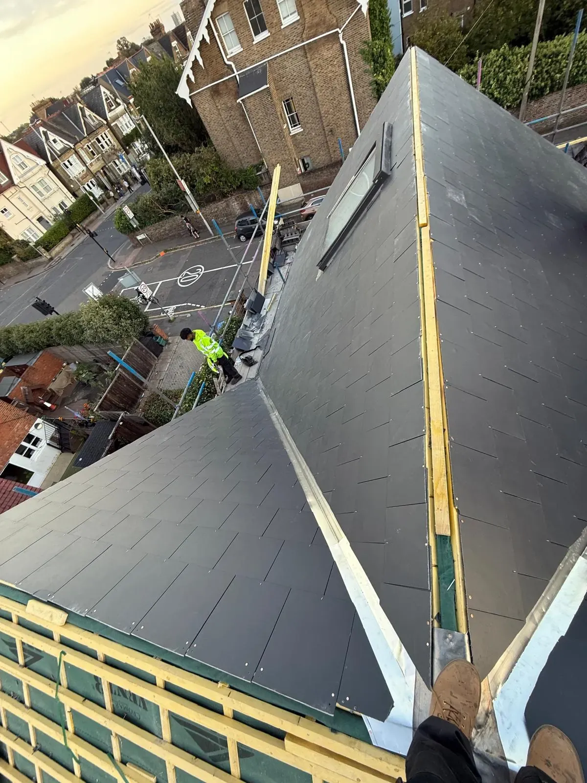 Slate roof valley being laid over new battens and membrane